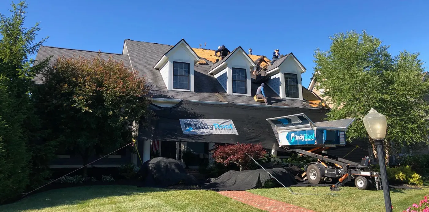 Tarping and dry-in on a Roann commercial roof
