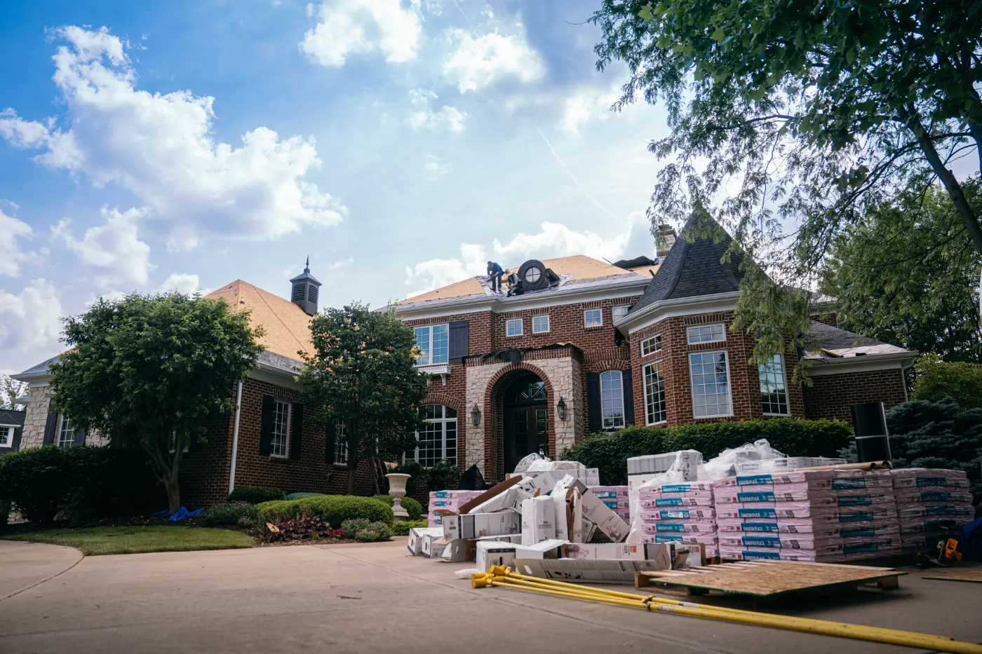 Tarping and dry-in on a Roann commercial roof